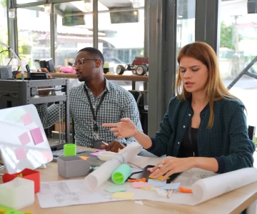 A man and a woman discussing the best strategy