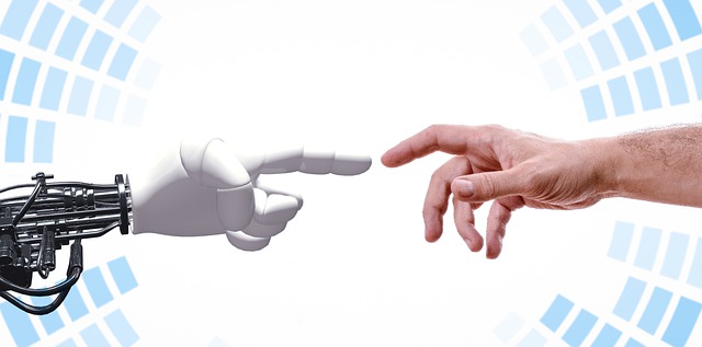 Image of a human and a robot hand reaching to each other
